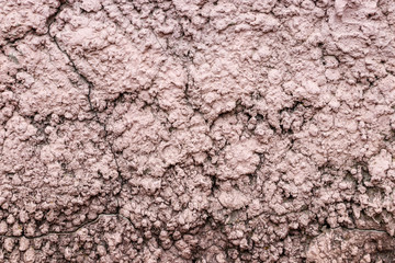 Background from the spray of gray cement. Cement covered with cracks