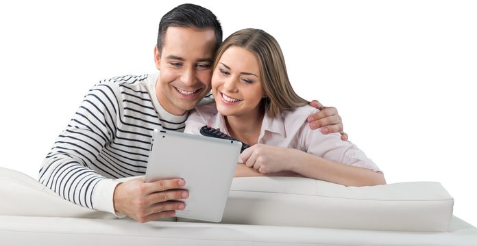 Smiling Couple Using a Tablet