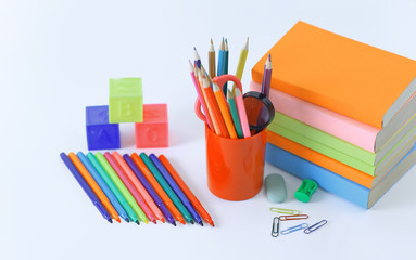 magnifier, paper clip and school supplies on white background .photo with copy space