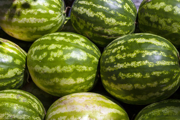 Market counter with delisios watermelons.