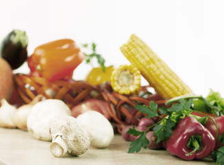 mushrooms on a background of fresh vegetables.