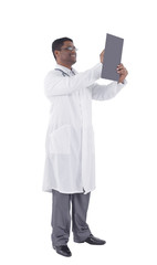 General practitioner writing a prescription.isolated on white