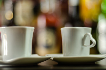 black coffee in a ceramic cup on the bar, energy drink in a public place