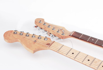 in the foreground .the fretboard of an acoustic guitar. isolate