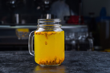 Fragrant sea buckthorn juice in a transparent Cup