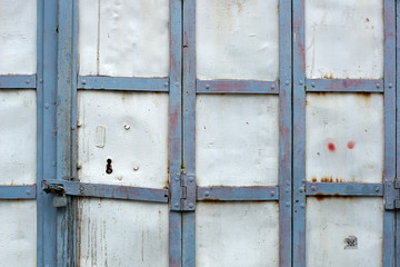 Blue and white metal gate