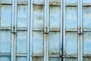 Old blue color metal industrial fence & door shades