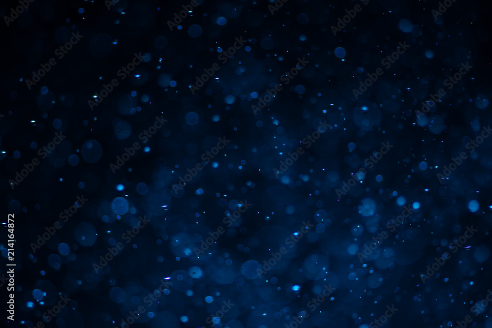 Wall mural abstract blue bokeh with black background