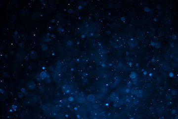 Abstract blue bokeh with black background