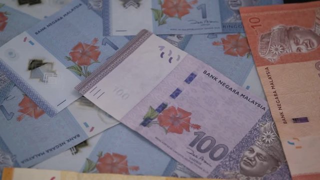 Bitcoin on Malaysian Ringgit Banknotes. National Currency of Malaysia. Digital Currency and Traditional Cash Money