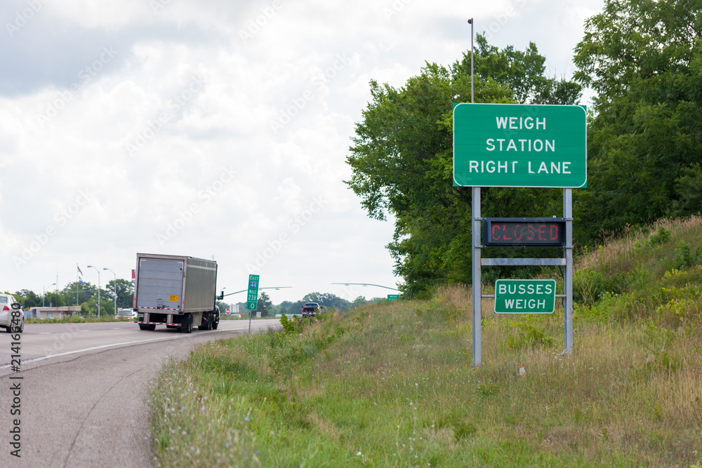 Wall mural weigh station sign on interstate 44 indicating the scale is closed, with highway in the background