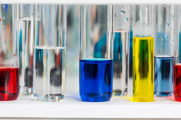 Beaker and colorful liquid.