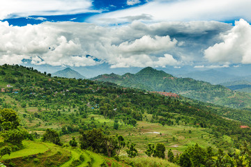 Obraz premium Arieal View of Beautiful Nepali Village sorrounded by the Green Forest,Mountain Village,Gorkha Nepal