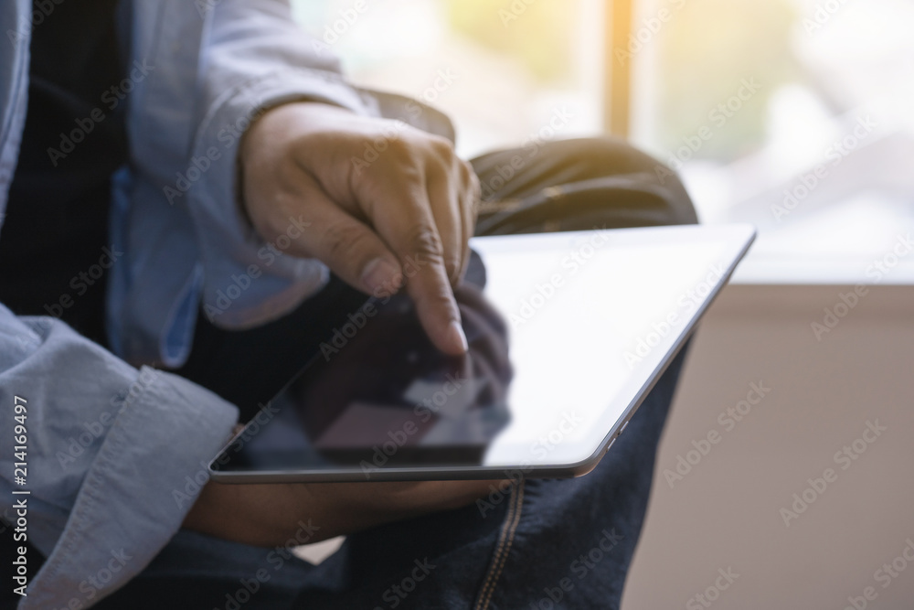 Poster digital tablet computer close up man using tablet hands man multitasking with isolated screen