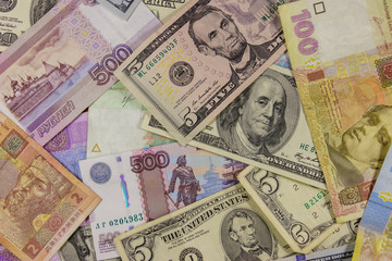 Multicurrency background of the us dollars, russian rubles and ukrainian hryvnias