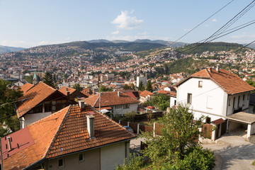 Fototapeta premium A distant view of Saravejo old town from a residential district on a hill south of Bosnia and Herzegovina capital city in Eastern Europe