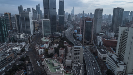 Fototapeta na wymiar Aerial view of highway and buildings in West Yan`an road, Shanghai city on a cloudy day