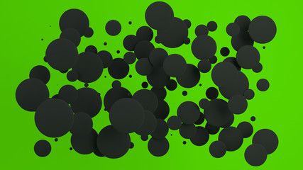Black discs of random size on green background