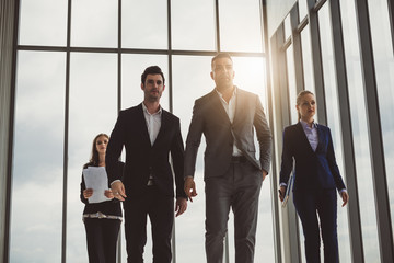 Group of business people walking in office with smart and confident, teamwork and together concept