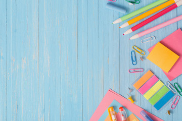 school supplies on  blue wooden background