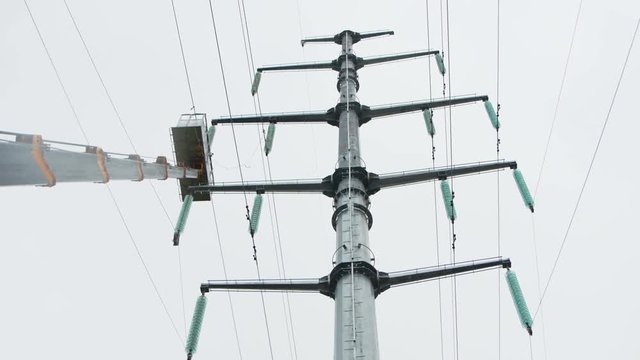 truck crane jib with cradle and metal pole for high voltage line
