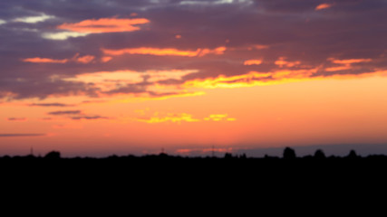 Obraz na płótnie Canvas Beautiful sunset. Blurred image of the dramatic sunset in the steppes in the Astrakhan region. Russia. Dramatic clouds as a natural background.