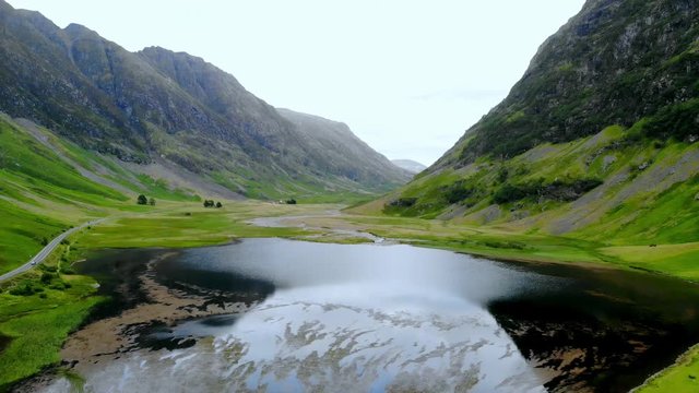 Flight over the awesome landscape of Glencoe in the Highlands of Scotland