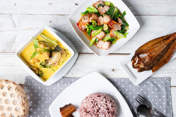 Pork curry with water spinach (Tae-pho soup) and Steamed rice berry in white plate