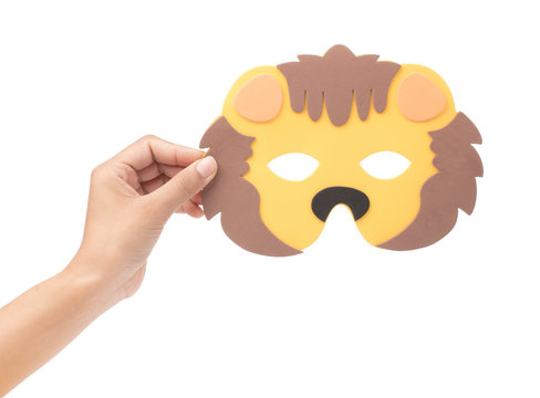 hand holding Lion animal carnival mask isolated on white background