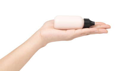 hand holding makeup liquid foundation isolated on white background