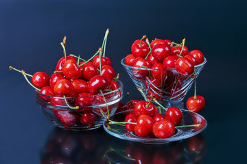 Fototapeta na wymiar Ripe fresh cherries isolated on black background