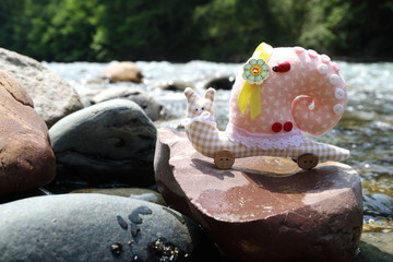 The image of the toy is a snail. Handmade.