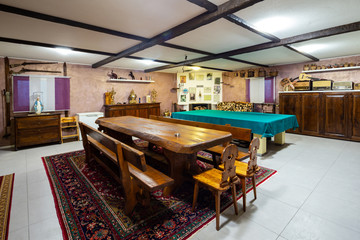 Tavern in a private house with a large wooden table