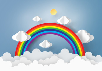 Origami made paper cloud and rainbow in the sky. paper art design style.