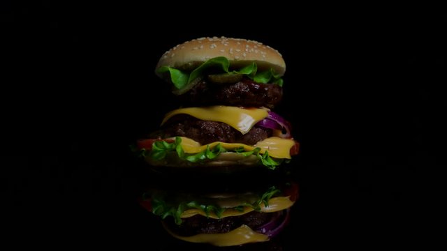 Savory burger is cooked on fire