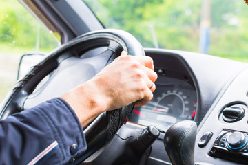 man driving a car close-up