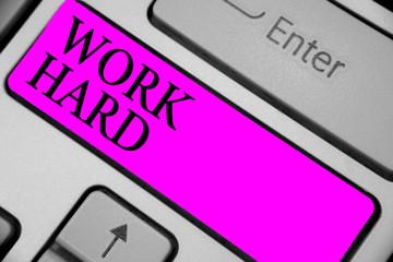 Handwriting text writing Work Hard. Concept meaning Laboring that puts effort into doing and...