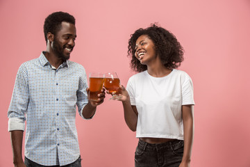 The afro couple or happy young people laughing and drinking beer at studio
