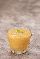 Tropical fresh fruit set and juice smoothies isolated with wooden background