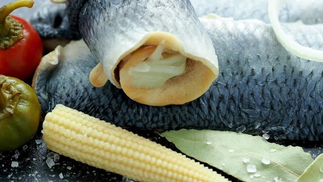 Cold appetizer. Herring fillet marinated. View from above. Marinated sea fish. 4k resolution.