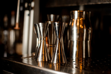 Set of barman stainless tools arranged on the bar counter © fesenko