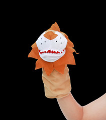 Hand wearing Lion puppets isolated on black background, Lion head.