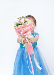 Little Asian child girl with Bouquet of roses for Valentine festival isolated on white background. Focus at rose flower.