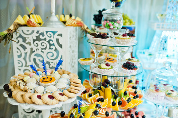 Wedding buffet with huge variety of friuts and different desserts.