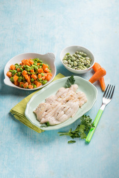 sole fish with carrot, green beans and broad beans salad
