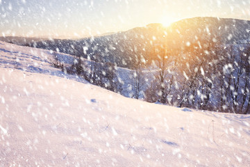 Snowy winter day in mountain hills.