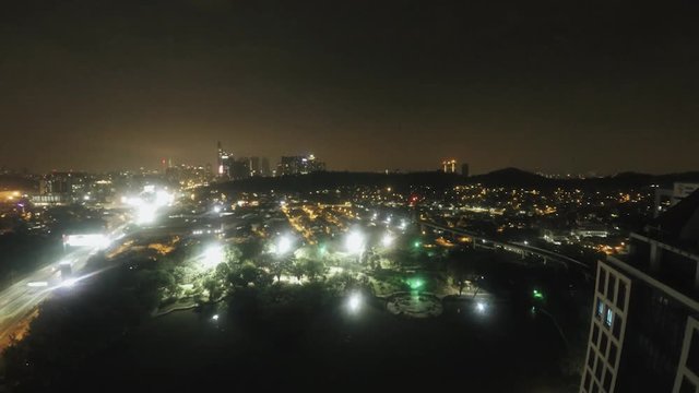 Time-lapse night Kuala Lumpur view from the lake