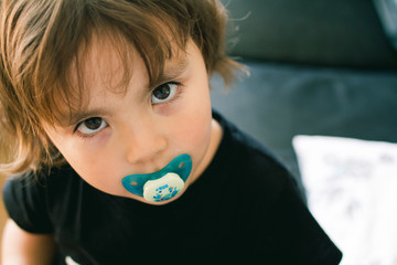 Little with a pacifier