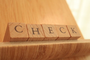 Wooden Block Text of Check