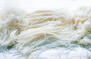 Rice Vermicelli, Rice Stick Noodles, Wide Rice Noodles texture/ pattern on white background.Raw rice noodles in oriental Asian food, Thai, Chinese, Japanese food.